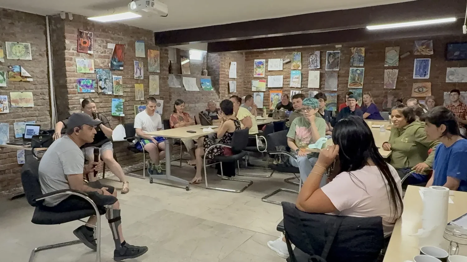 Izidor speaking to special needs art students