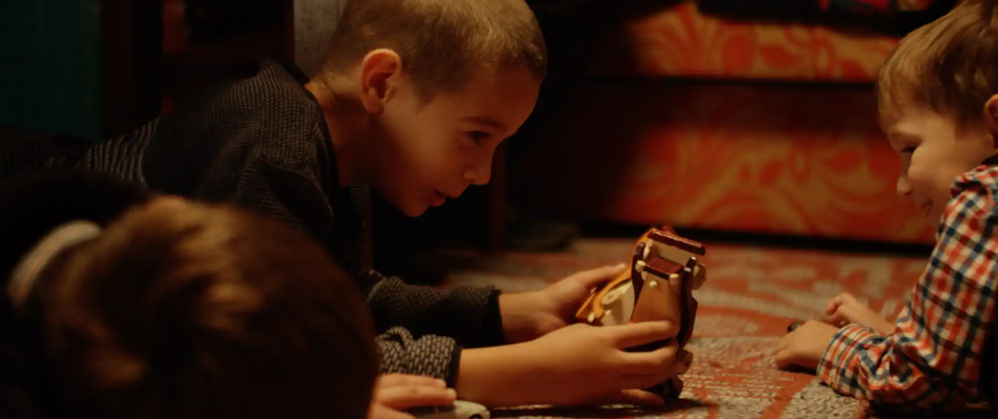 Izidor and new friends playing with toys
